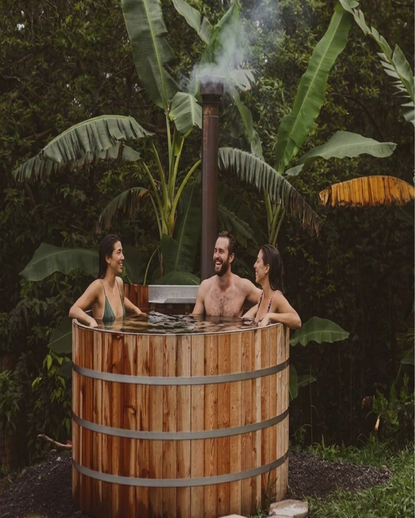 Friends sharing an outdoor hot tub ritual